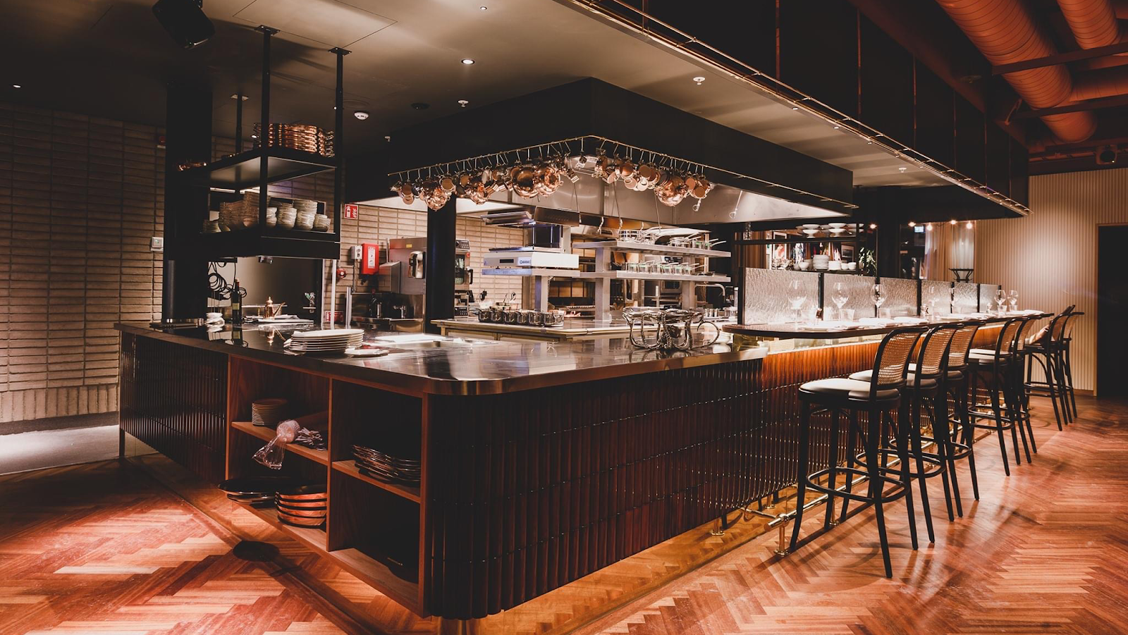 A marble brasserie bar in Stockholm set for a late dinner after midnight