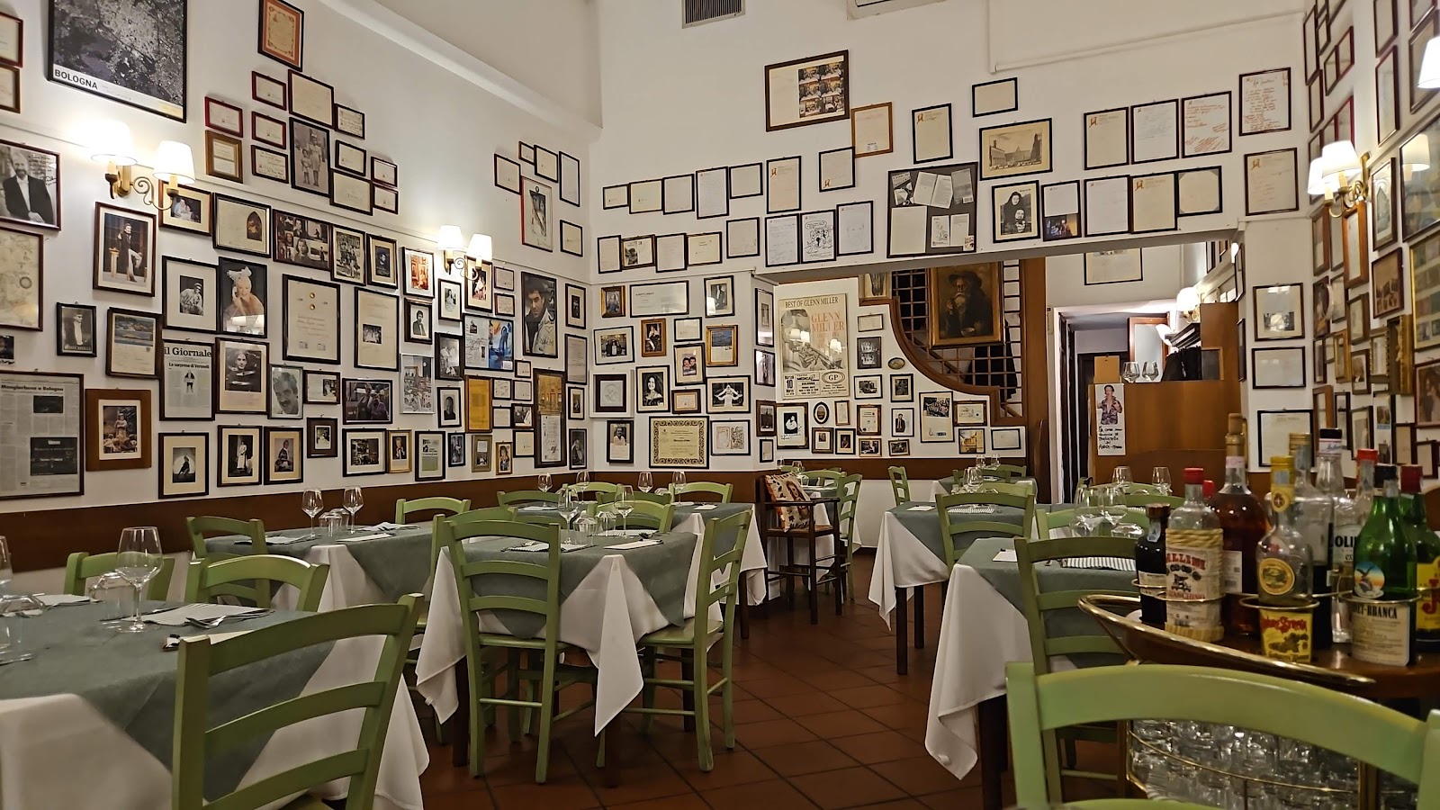 A family sharing tagliatelle al ragu at a trattoria in Bologna