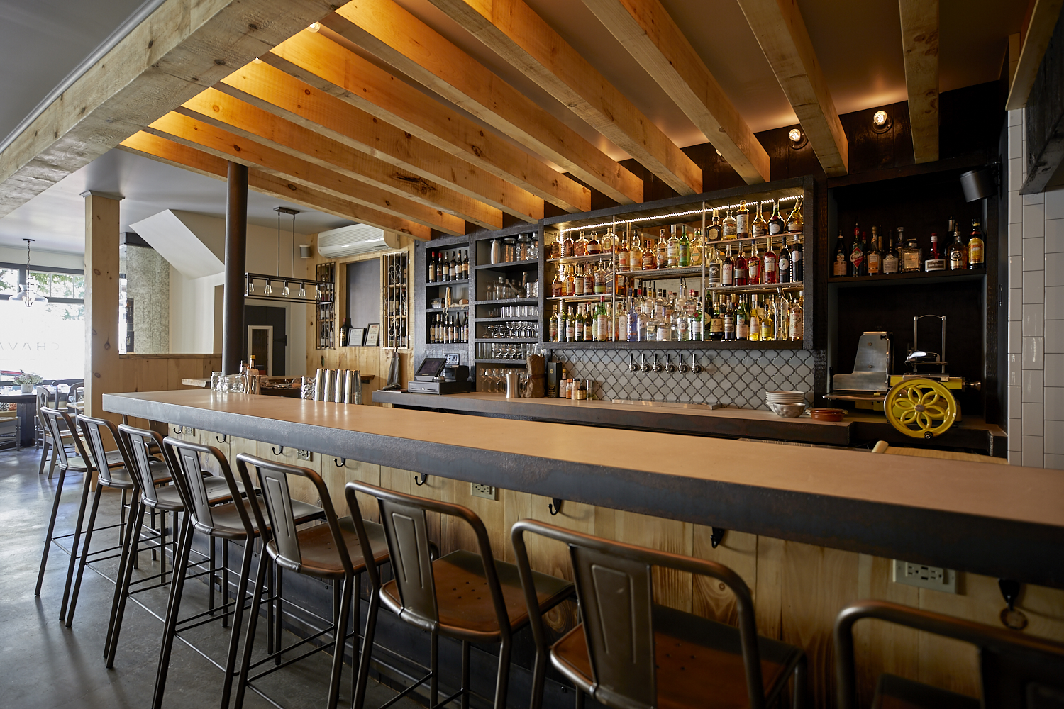 A candlelit two-top at a restaurant bar in Portland, Maine