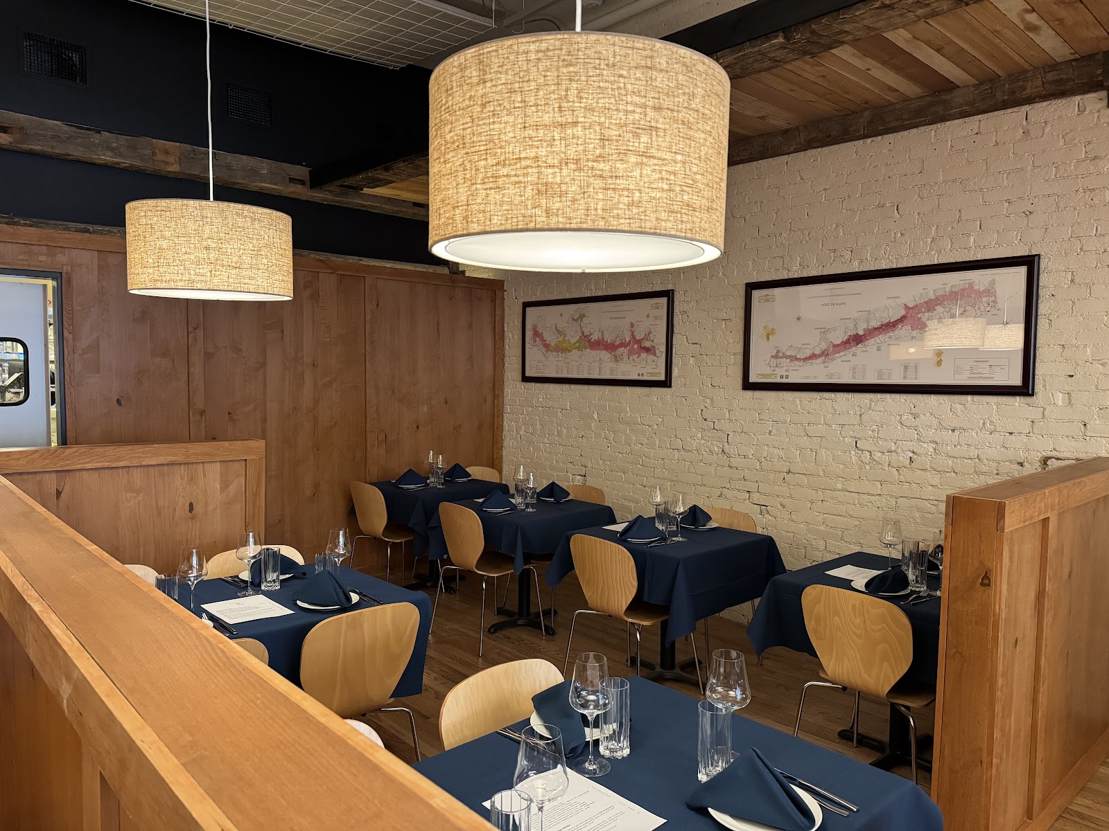 A candlelit small-plate wine bar table set for two in downtown Boulder