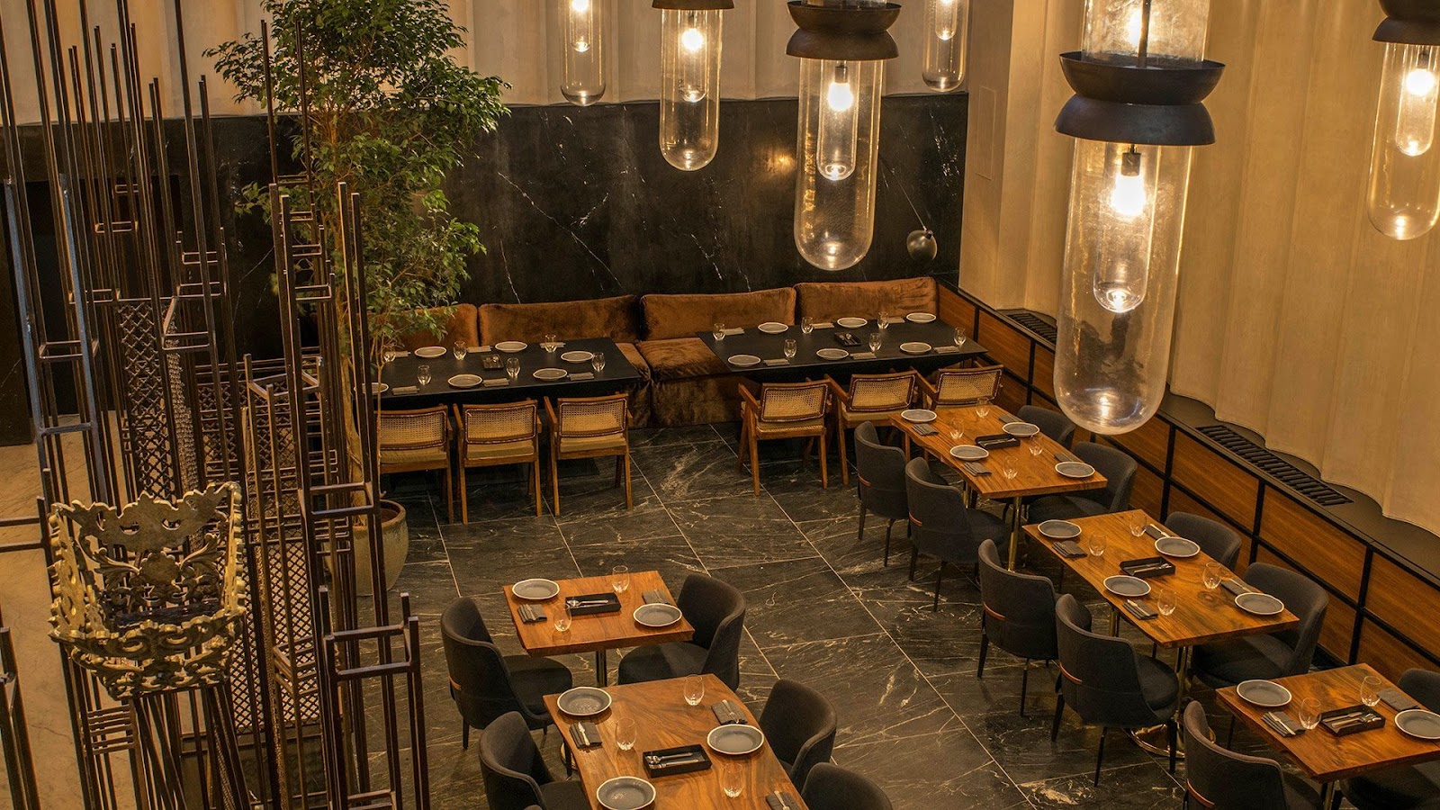 A polished hotel dining room set for a business dinner in Mumbai
