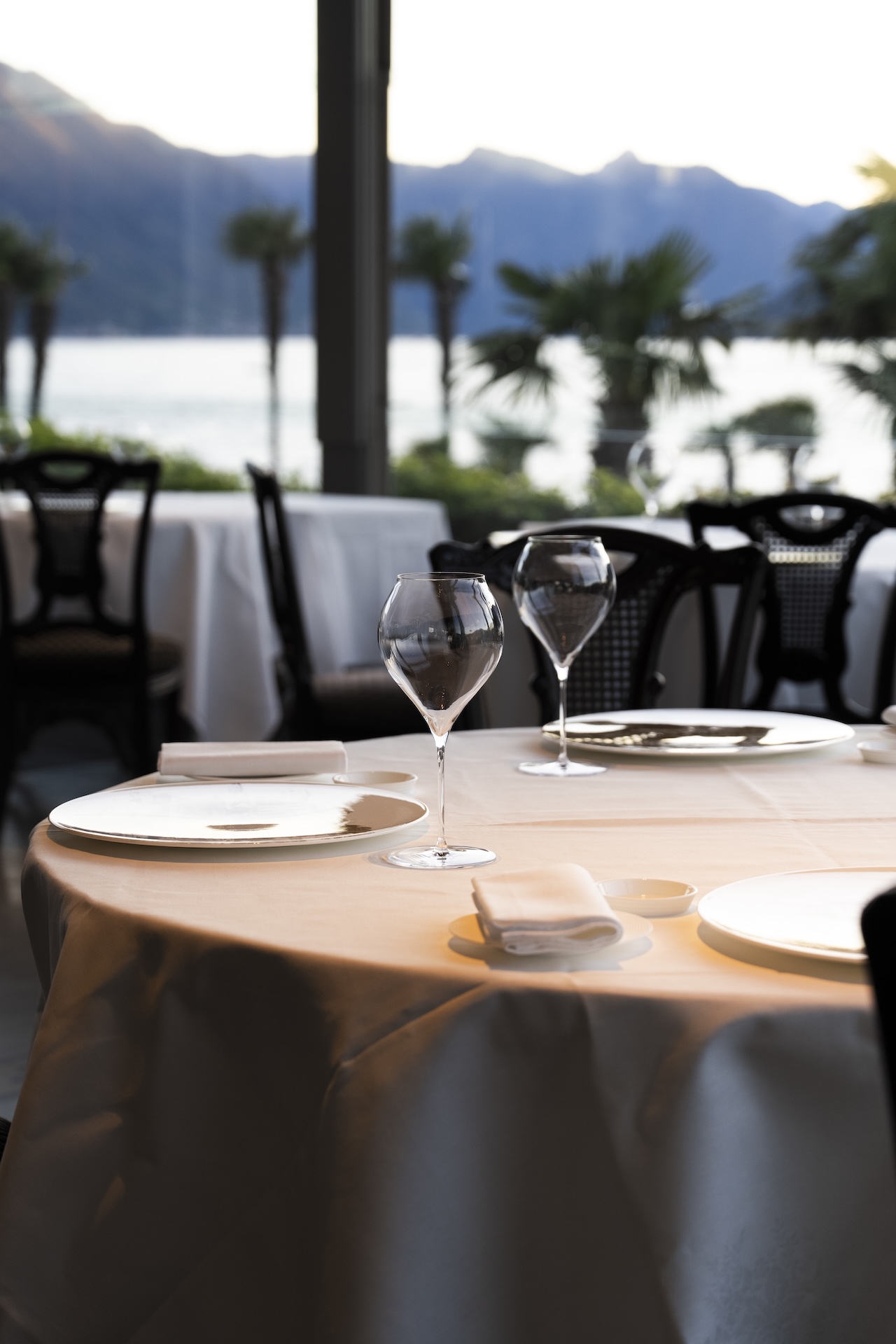 A lakeside terrace table set for a birthday celebration on Lake Como
