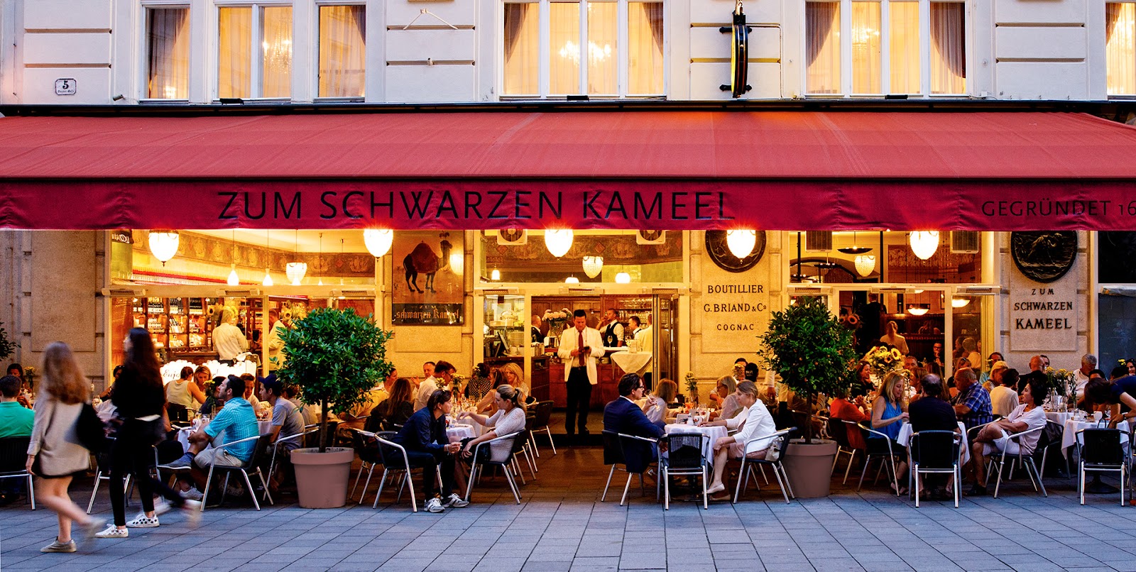 A marble Viennese bistro bar set for a late dinner after midnight