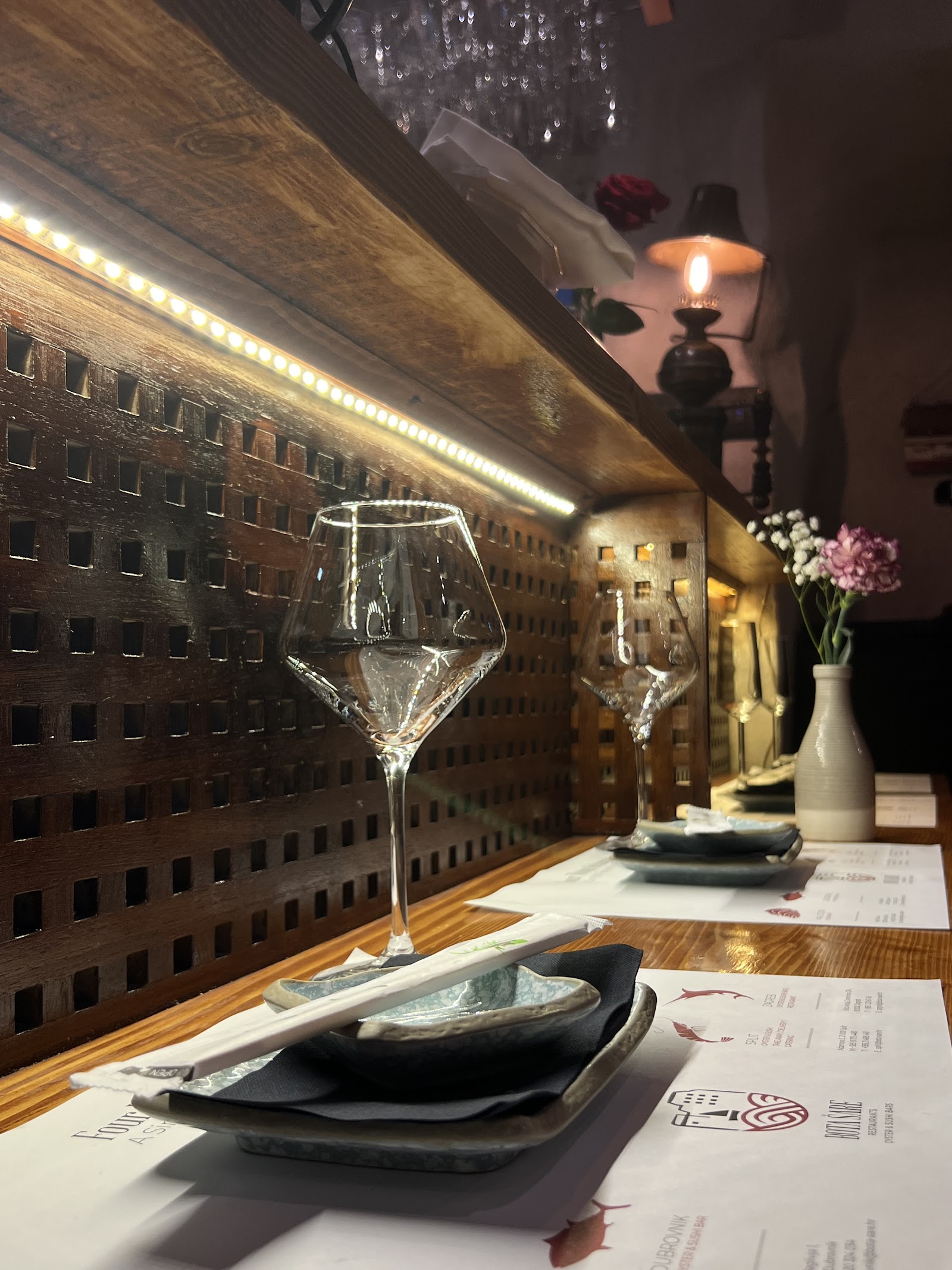 A single bar seat set for one diner at a wine kitchen in District V, Budapest