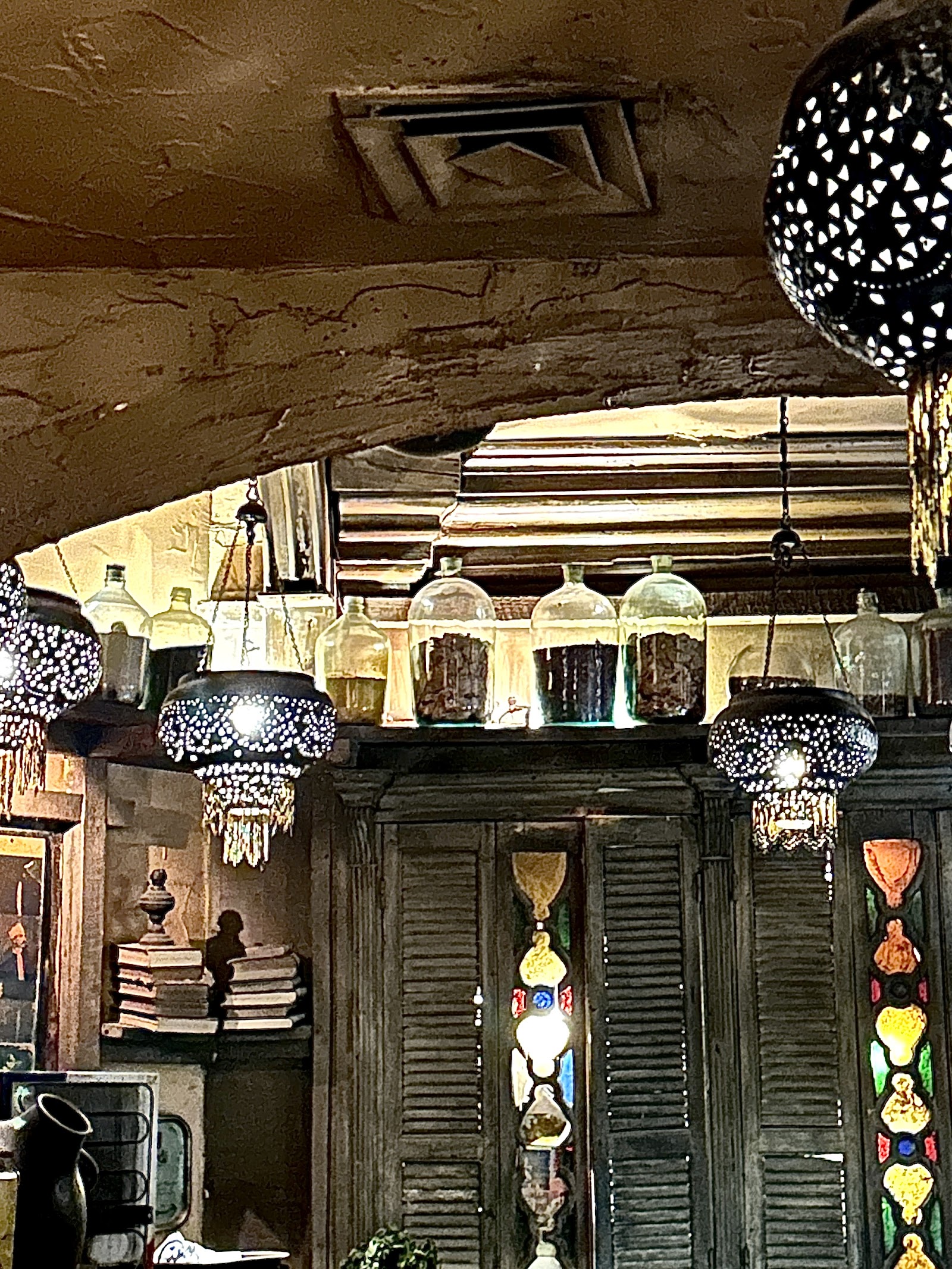 A Nile-side Zamalek restaurant terrace lit up after midnight in Cairo