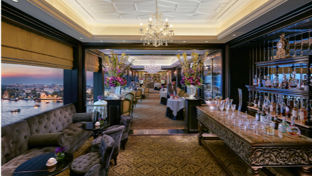 A private dining room set for a group dinner at a Bangkok fine-dining restaurant