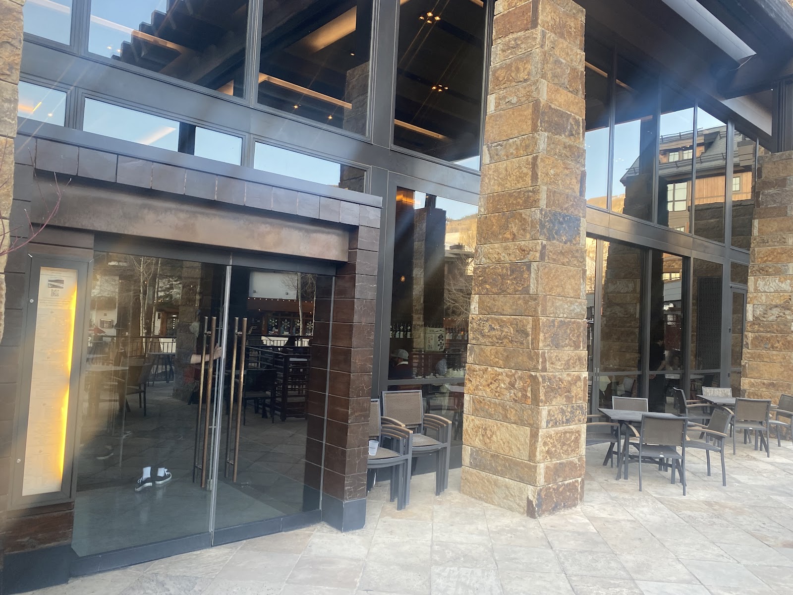 A single seat at a sushi bar with a view of Vail Mountain, Vail Village