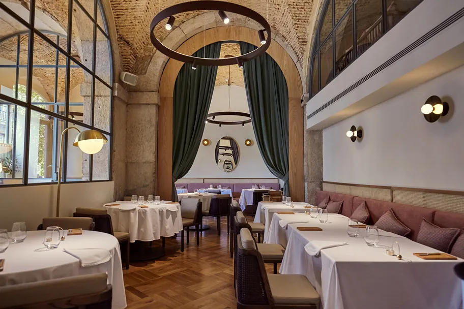 A long table set for a team dinner in a Chiado restaurant in Lisbon