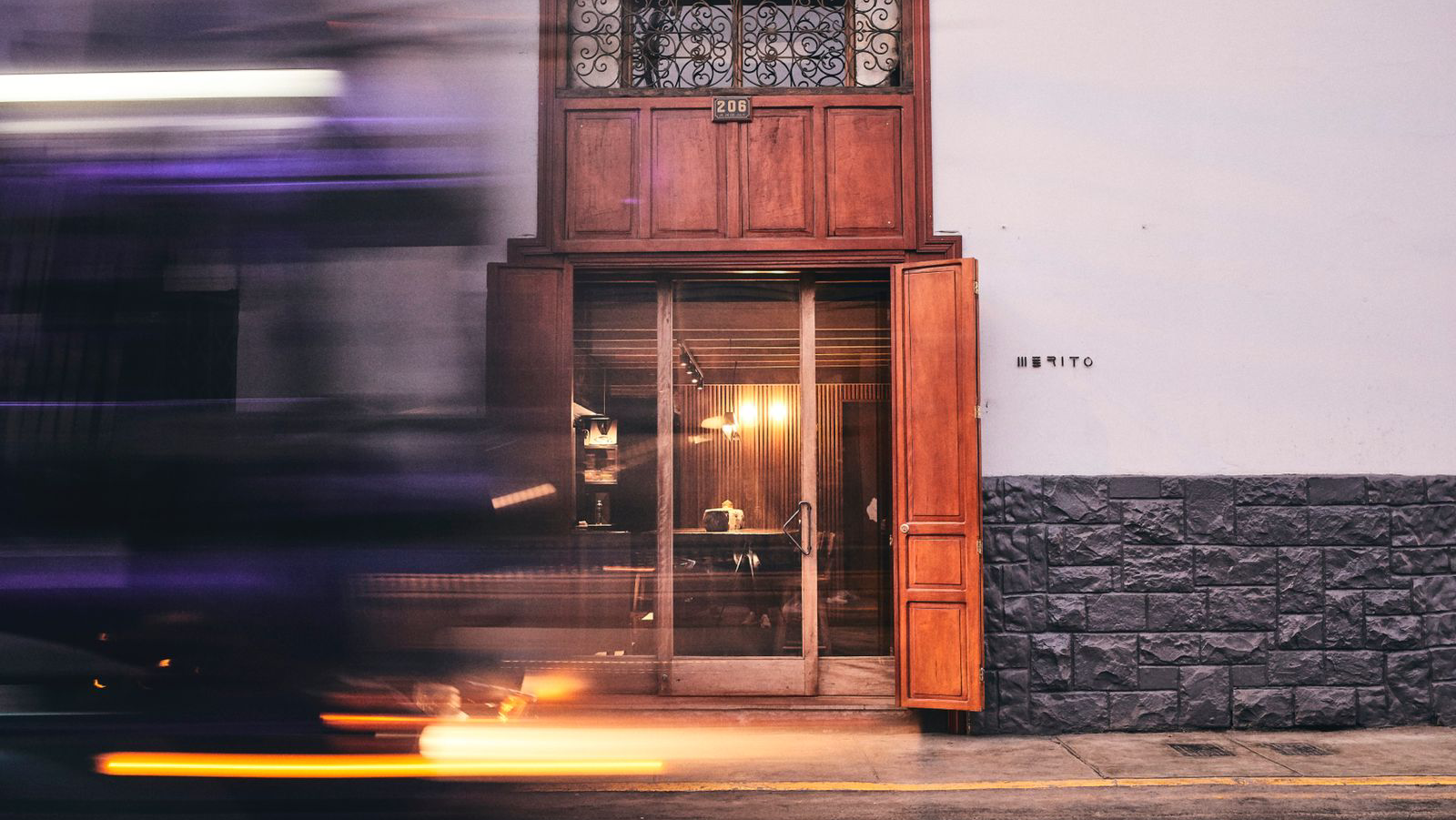 A candlelit two-top set for a first date in Barranco, Lima