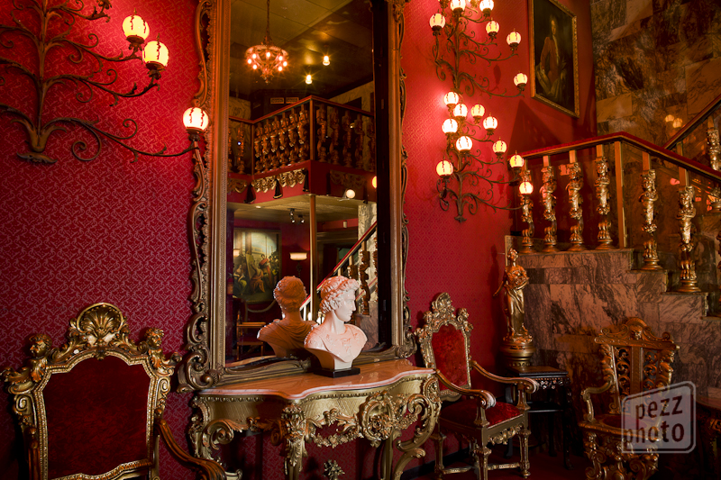 A glass-fronted wine cellar in a Tampa steakhouse dining room