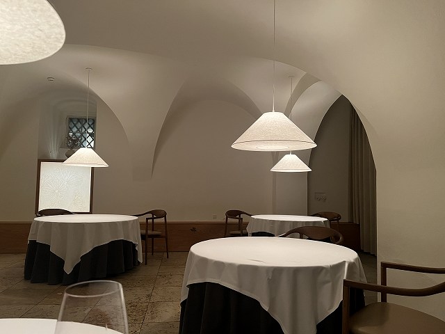 A well-spaced business dinner table in a discreet Copenhagen fine-dining room