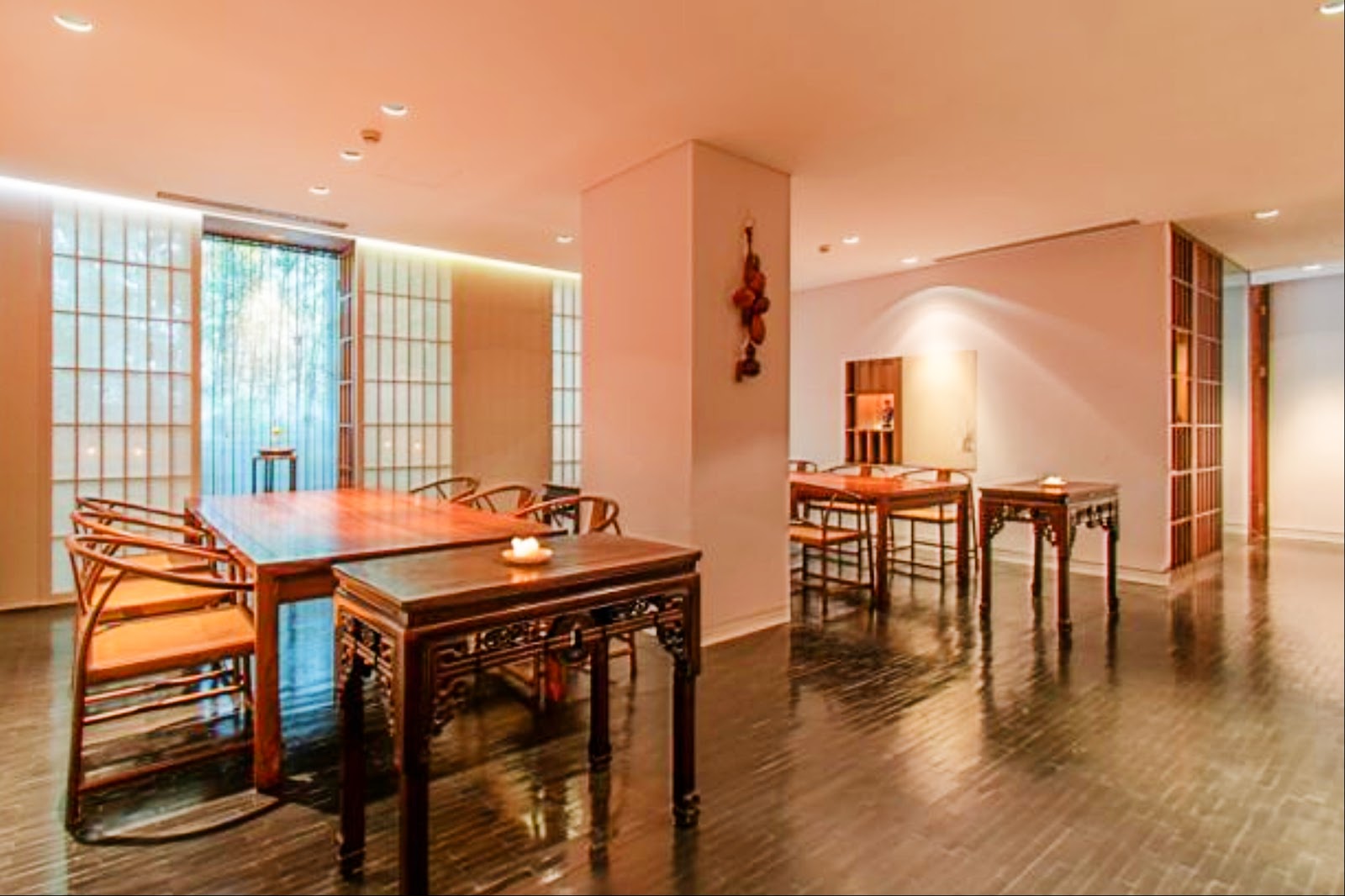 A quiet candlelit table for two set for a first date at a Shanghai restaurant near the Bund