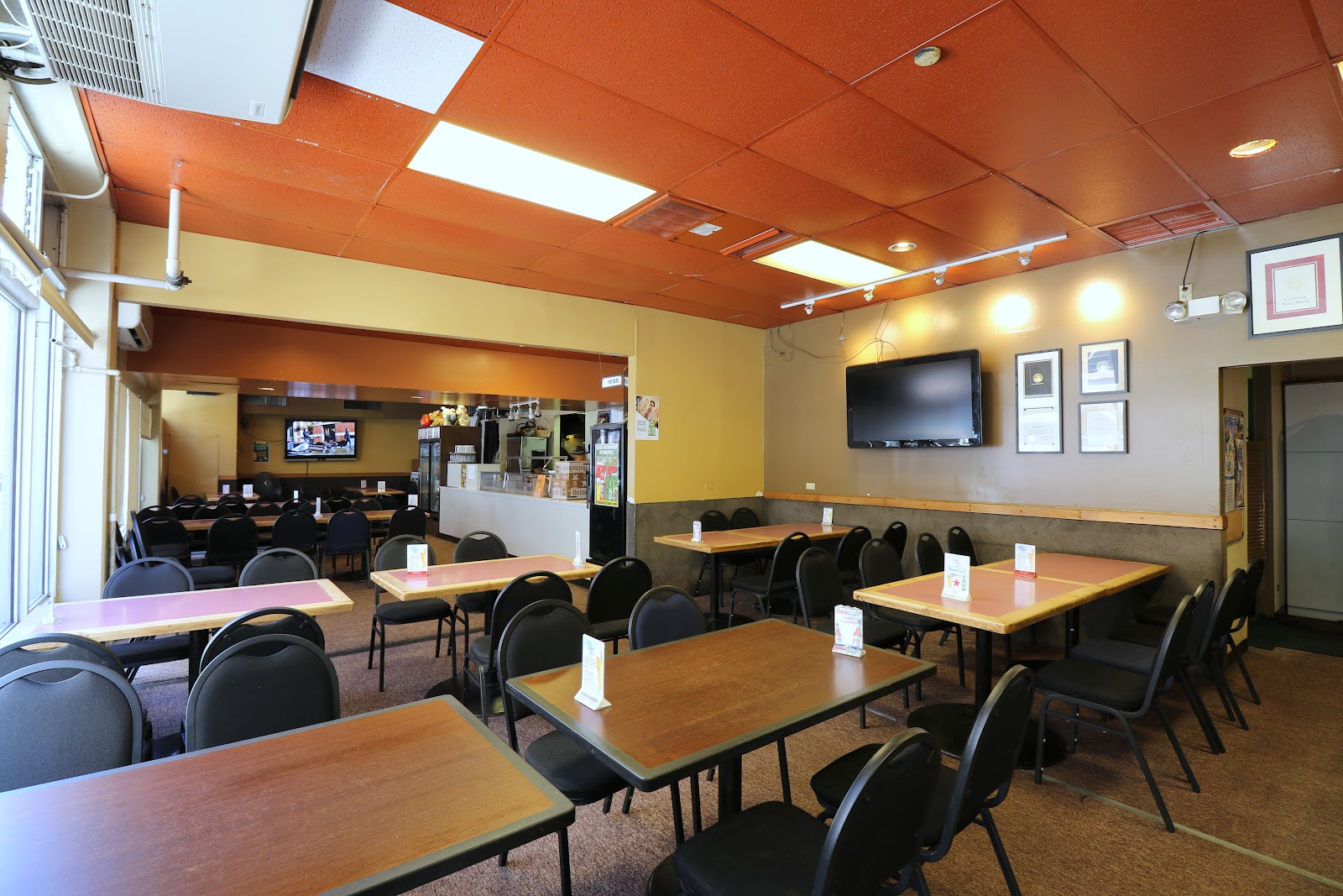 A Japanese izakaya counter serving skewers and small plates late at night in Honolulu