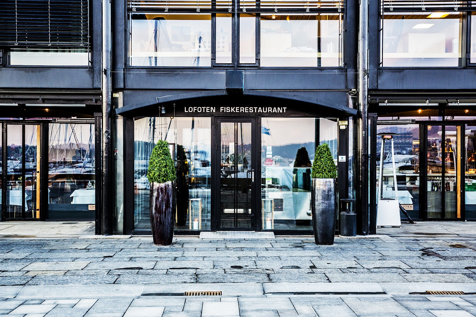 A long table set for a team dinner in a fjord-side Oslo seafood restaurant