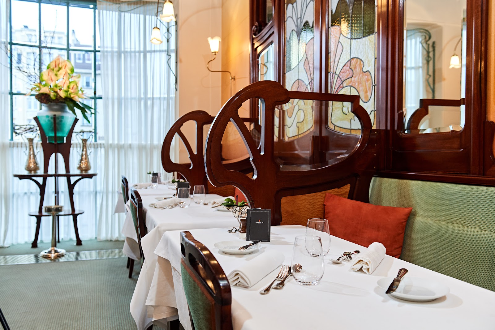 A celebratory dinner table set for a birthday in a Brussels restaurant