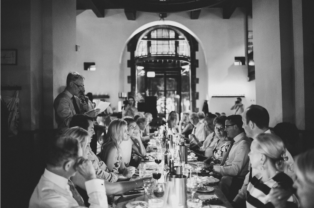 A long shared table set for a team dinner in a lively Amsterdam restaurant