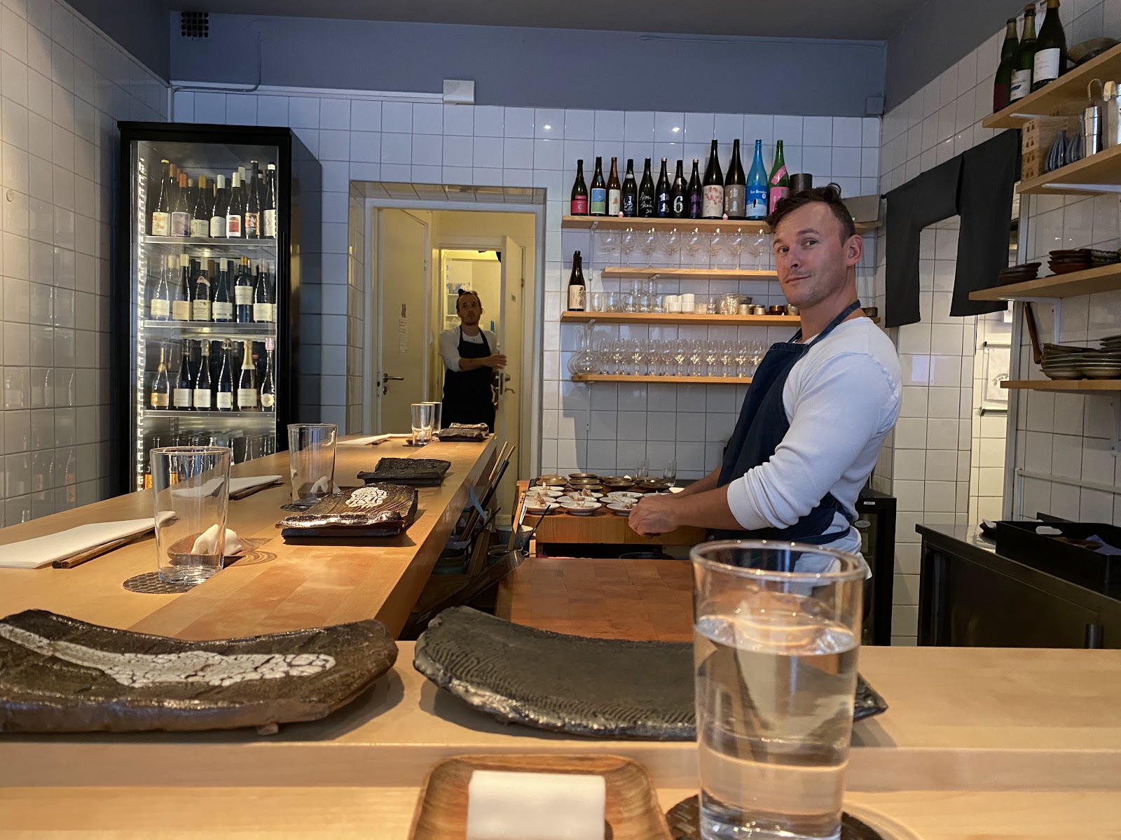 An omakase counter being plated at a Stockholm sushi restaurant