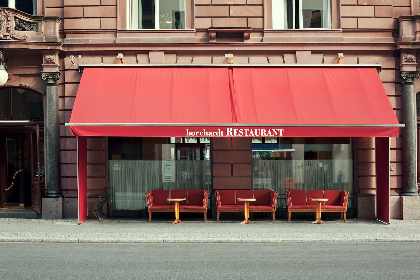 A grand brasserie table set for a midday business lunch near Gendarmenmarkt in Berlin