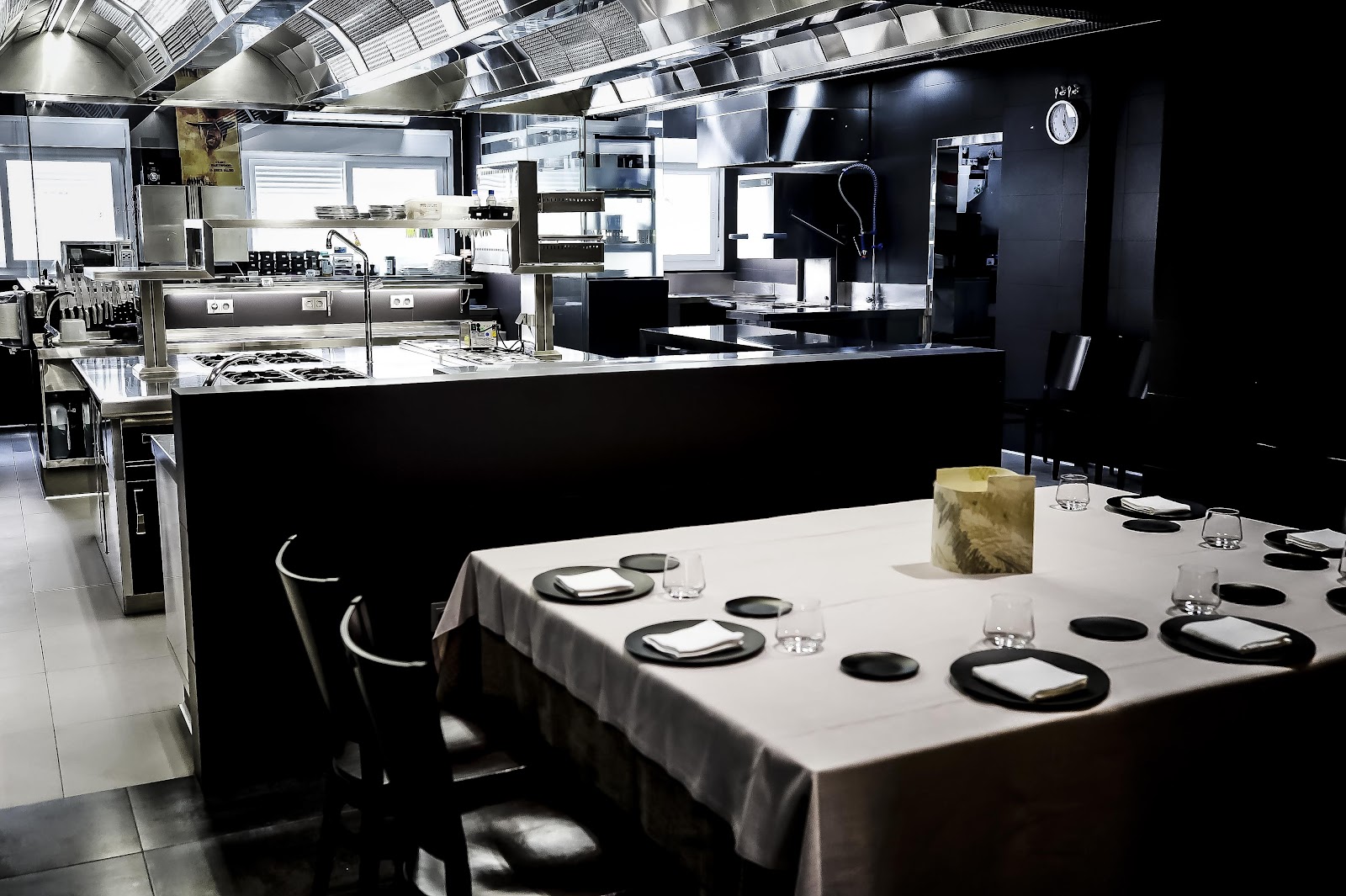 A refined Seville dining room with double-clothed tables set for a business dinner