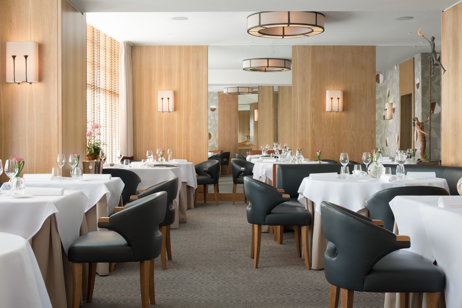 A discreet corner table set for a business dinner in a Leith dining room, Edinburgh