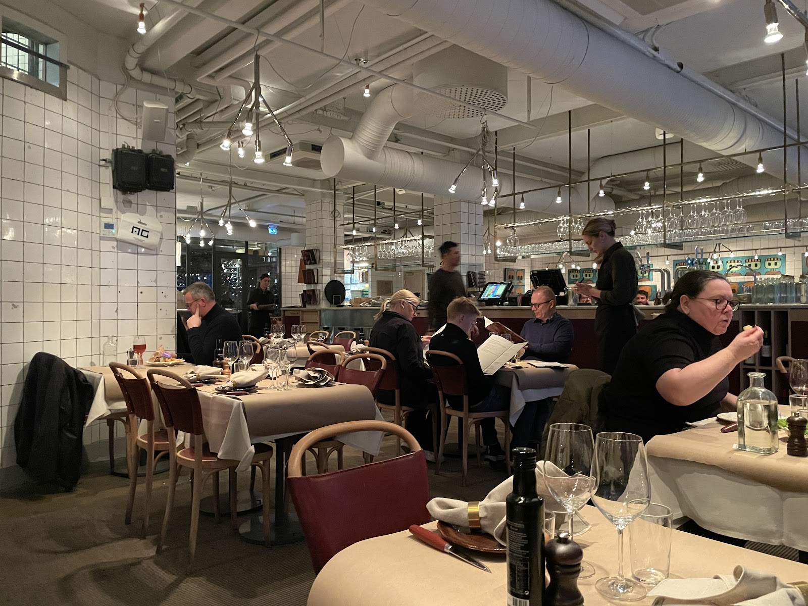 A private dining room set for a team dinner at a brasserie near Stureplan in Stockholm