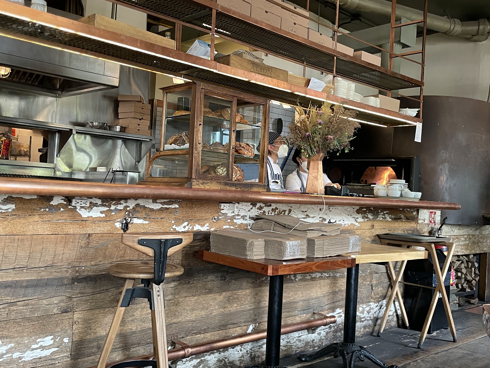 A Mexico City brunch table with chilaquiles, concha and a cafe de olla in a leafy Condesa courtyard