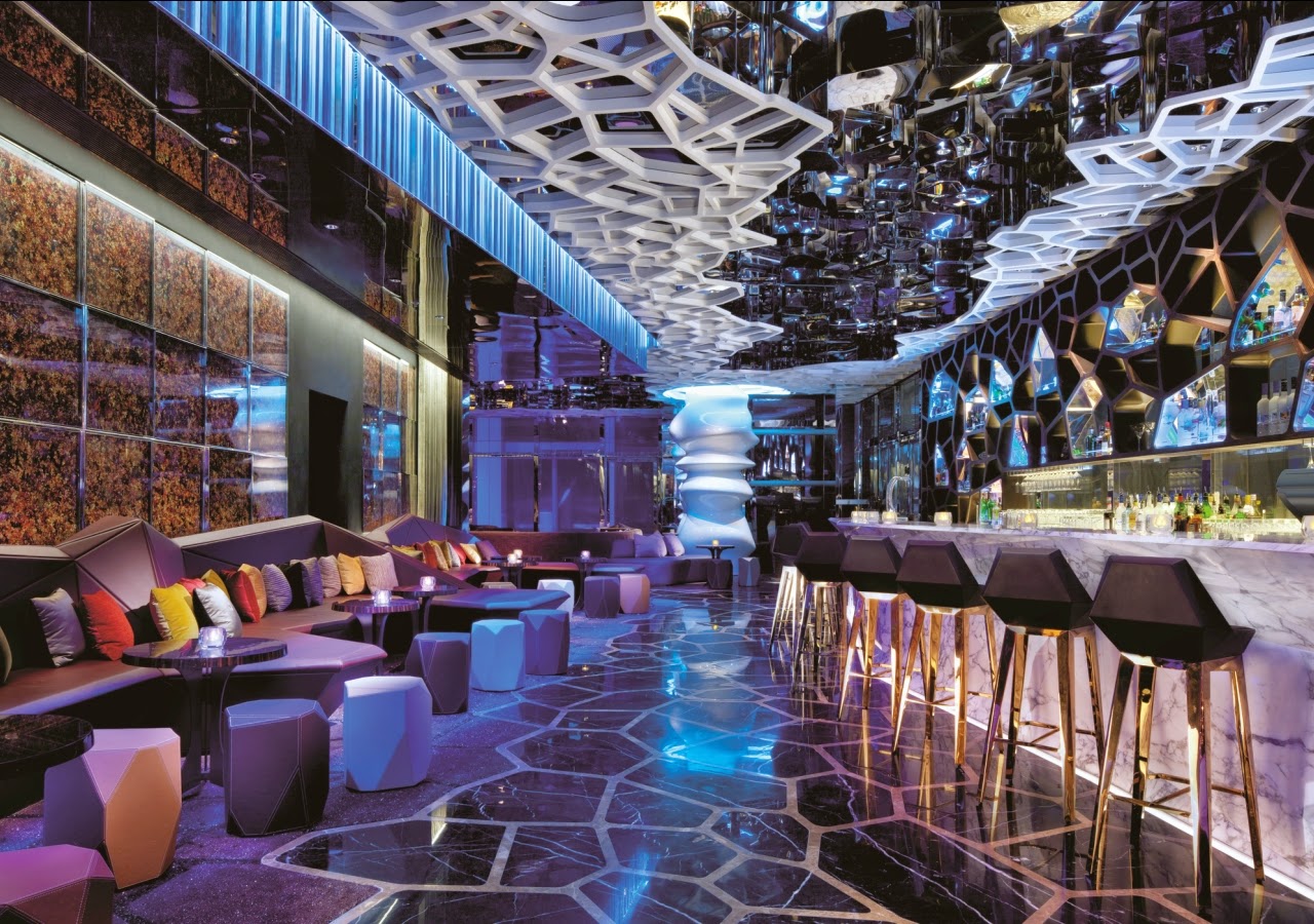 A rooftop restaurant terrace over the Victoria Harbour skyline in Hong Kong