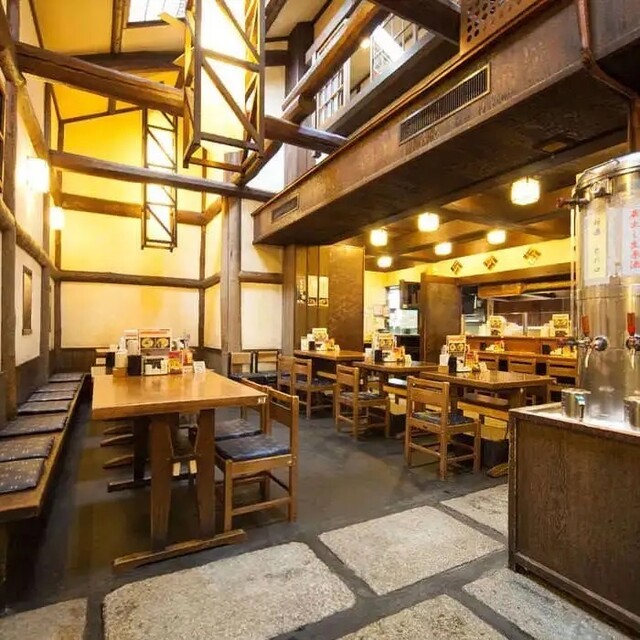 A charcoal yakitori and izakaya counter on Kiyamachi after dark, Kyoto