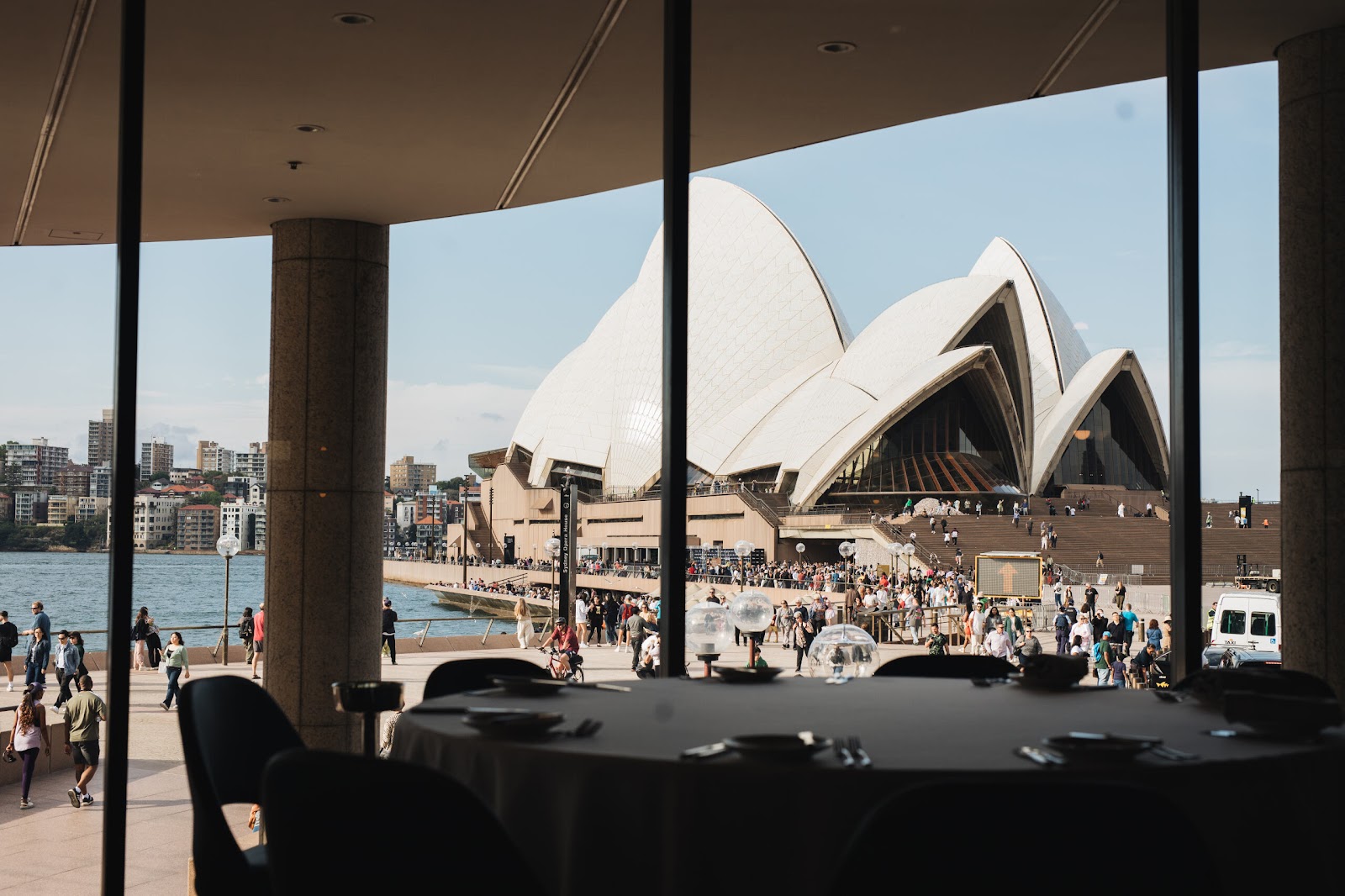 An elegant client dinner table with Sydney Opera House views set for two
