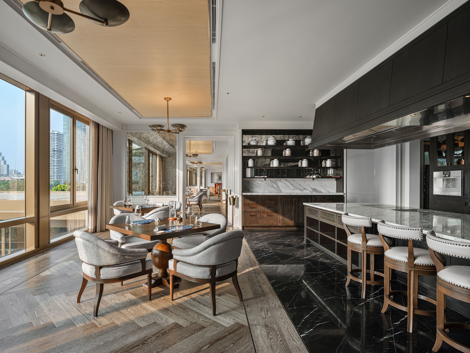 A fine-dining hotel restaurant dining room overlooking the Chao Phraya River in Bangkok