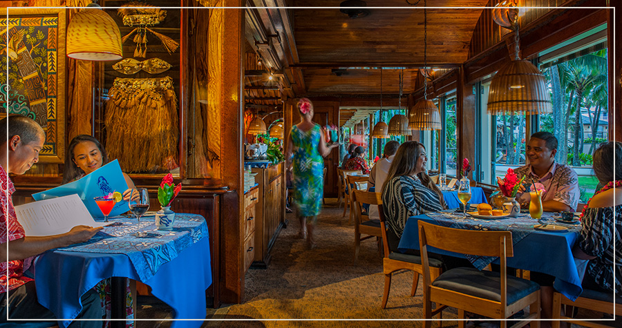 An oceanfront fine-dining terrace set for a client dinner on Maui at sunset