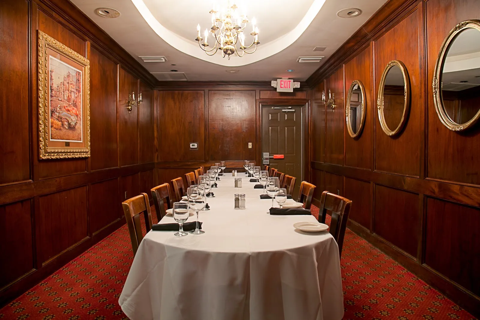 A private dining room set for a large group at an Orlando steakhouse