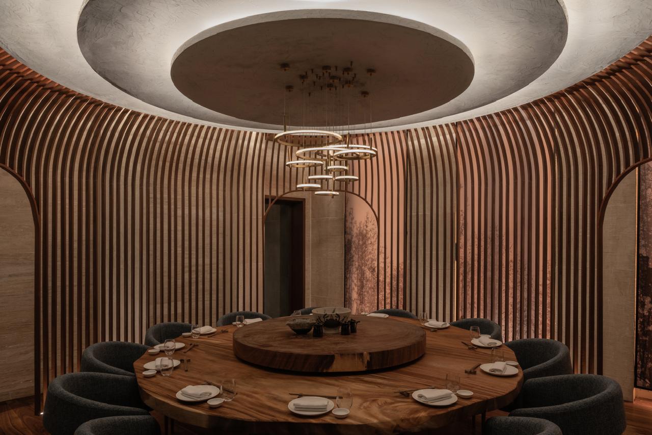 A quiet low-lit corner table set for a first date in Al Olaya, Riyadh