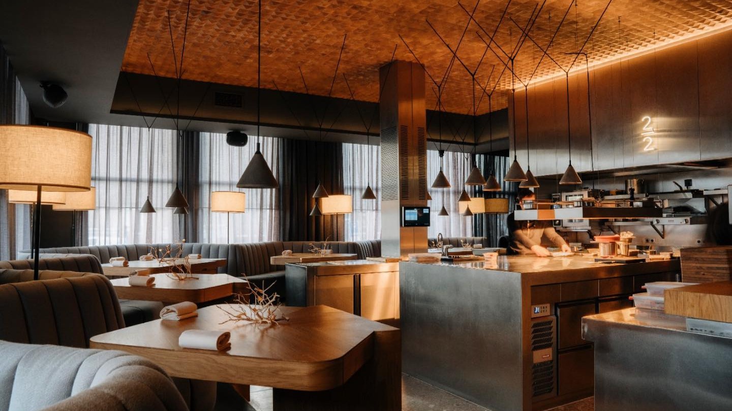 A single place setting at the kitchen counter of an Amsterdam fine-dining restaurant