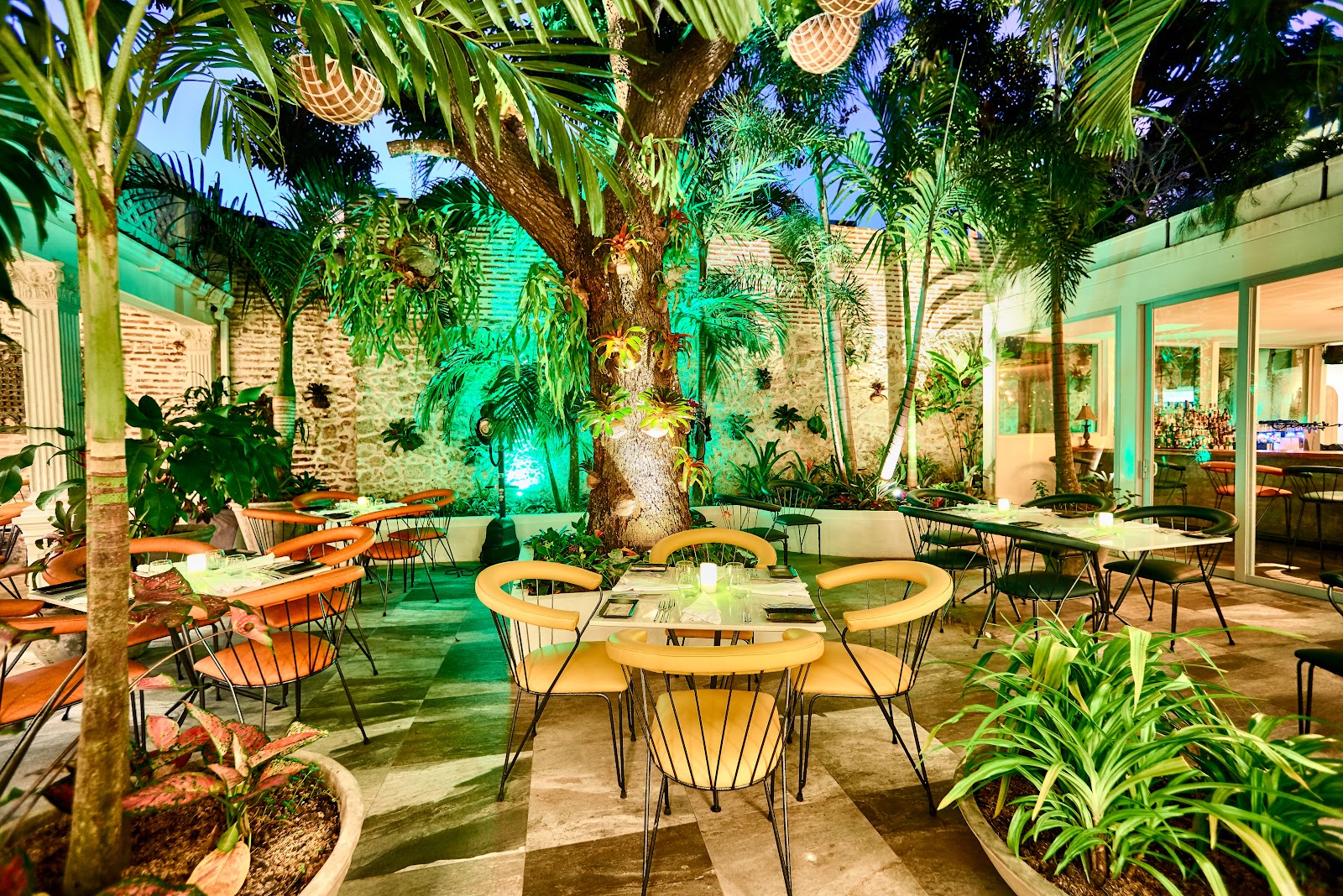 A candlelit courtyard table set for an anniversary dinner in Cartagena's Walled City