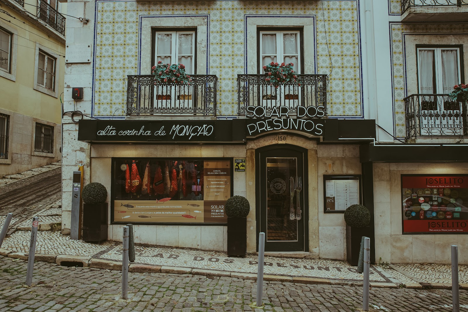 A quiet wood-panelled dining room set for a business dinner in central Lisbon