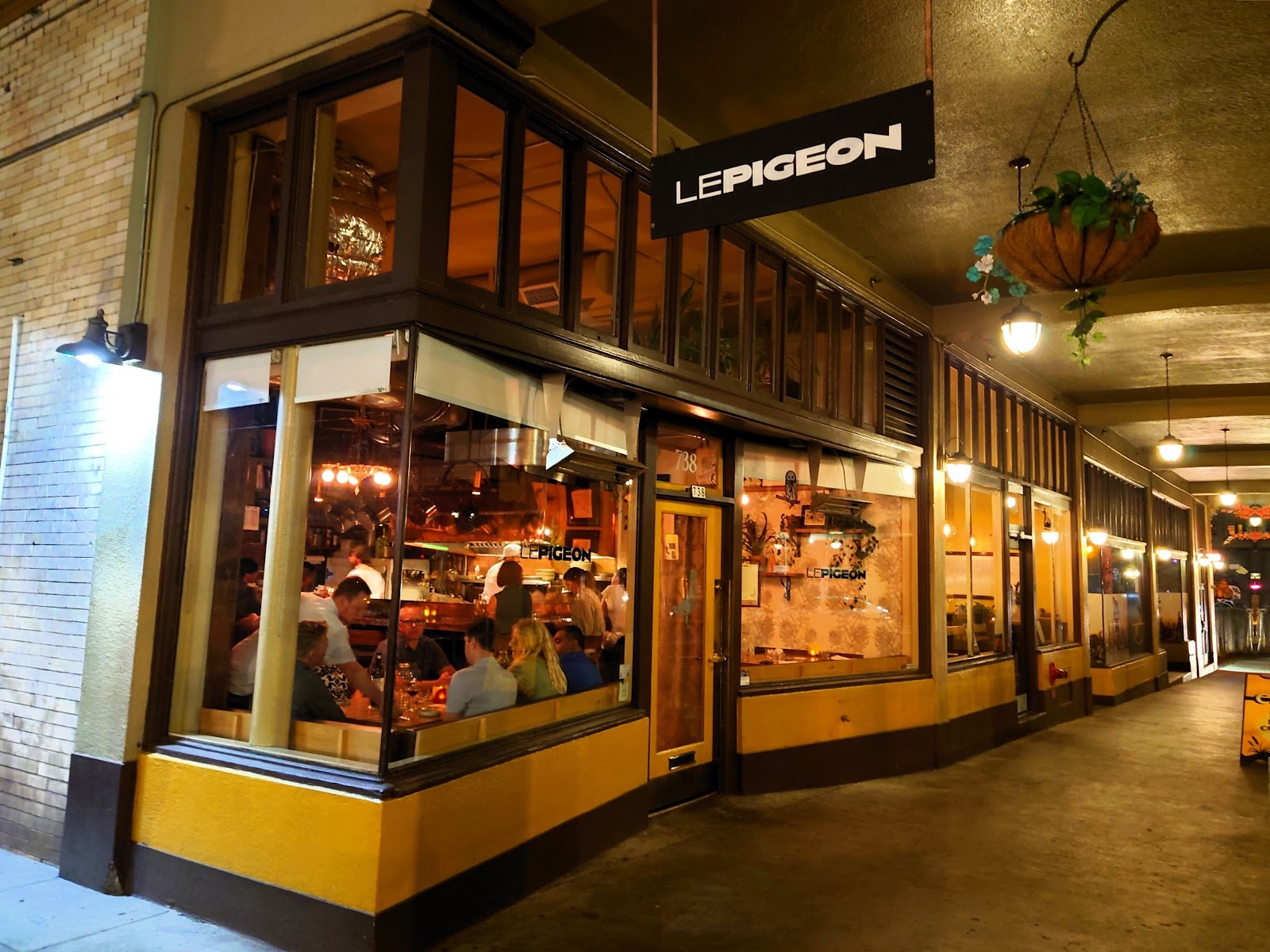 A candlelit two-top in a small Portland restaurant at dinner service