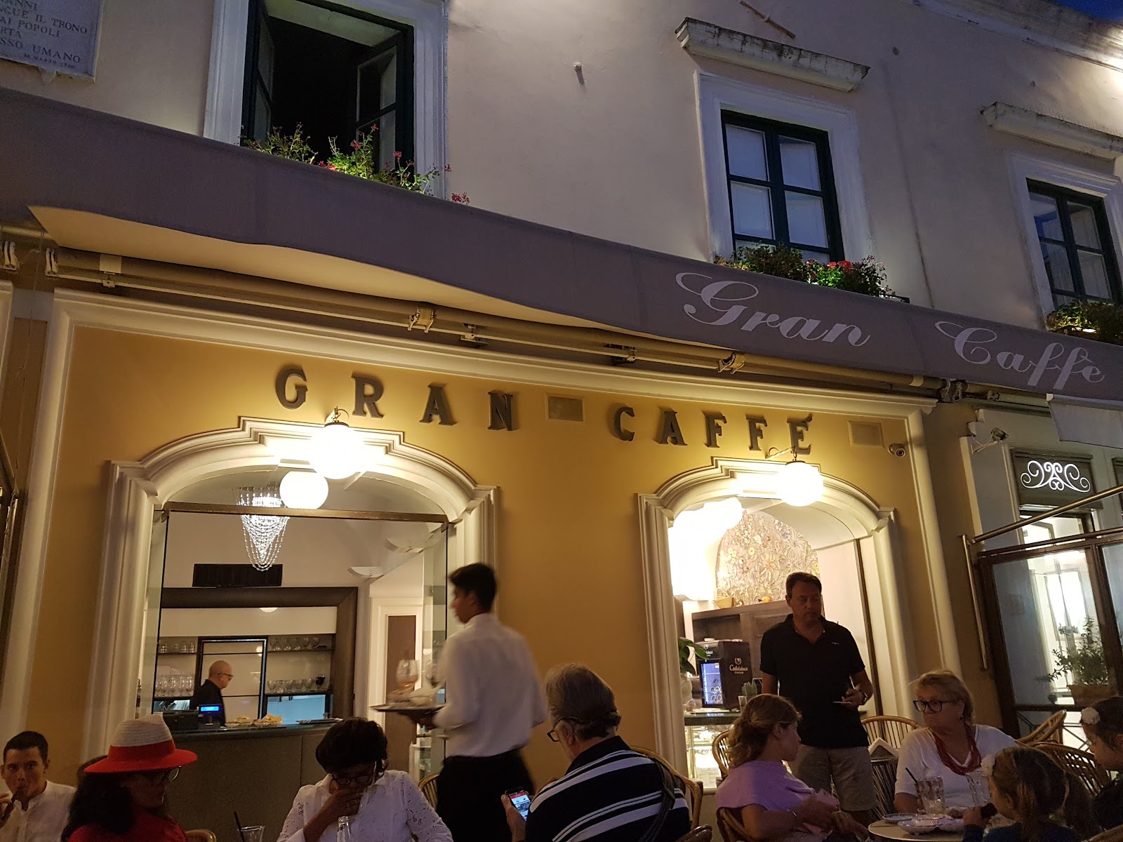 A single table set with a plate of ravioli capresi on a Capri terrace