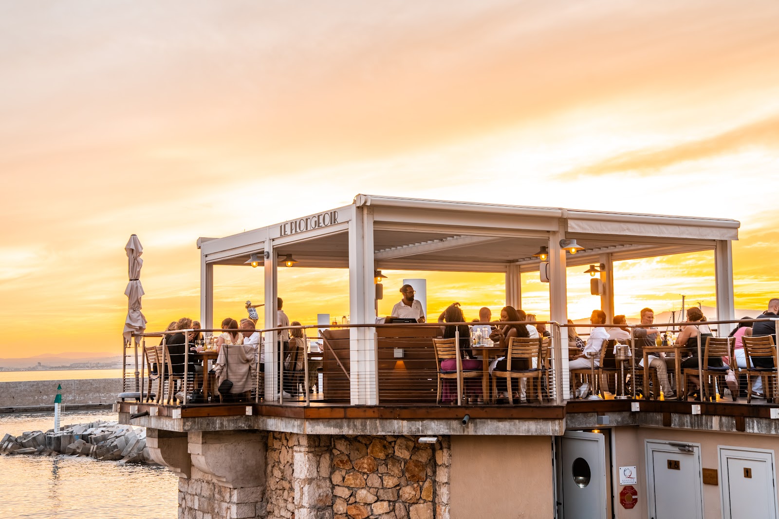 The Baie des Anges and the Promenade des Anglais from a terrace at sunset, Nice