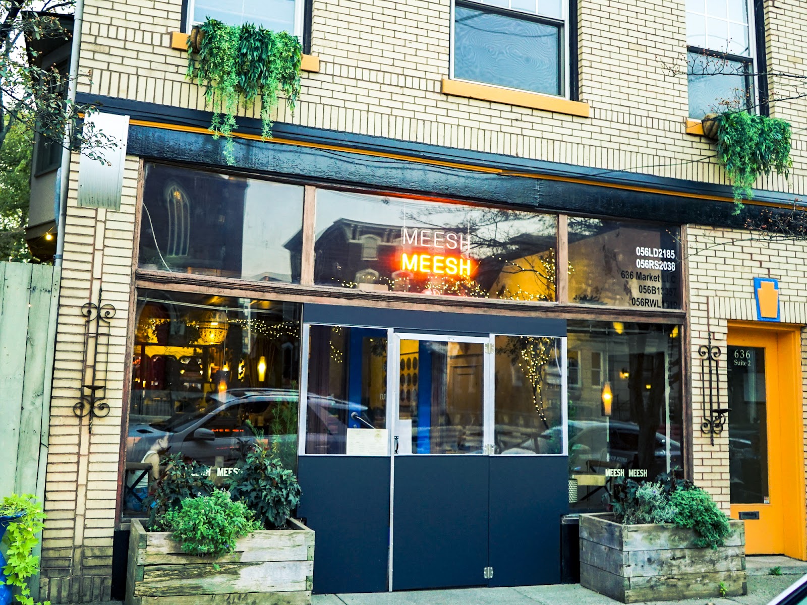 A candlelit small-plates and wine bar table set for two in NuLu, Louisville