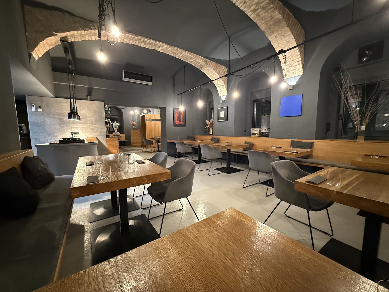 A candlelit two-top in an intimate Vienna restaurant